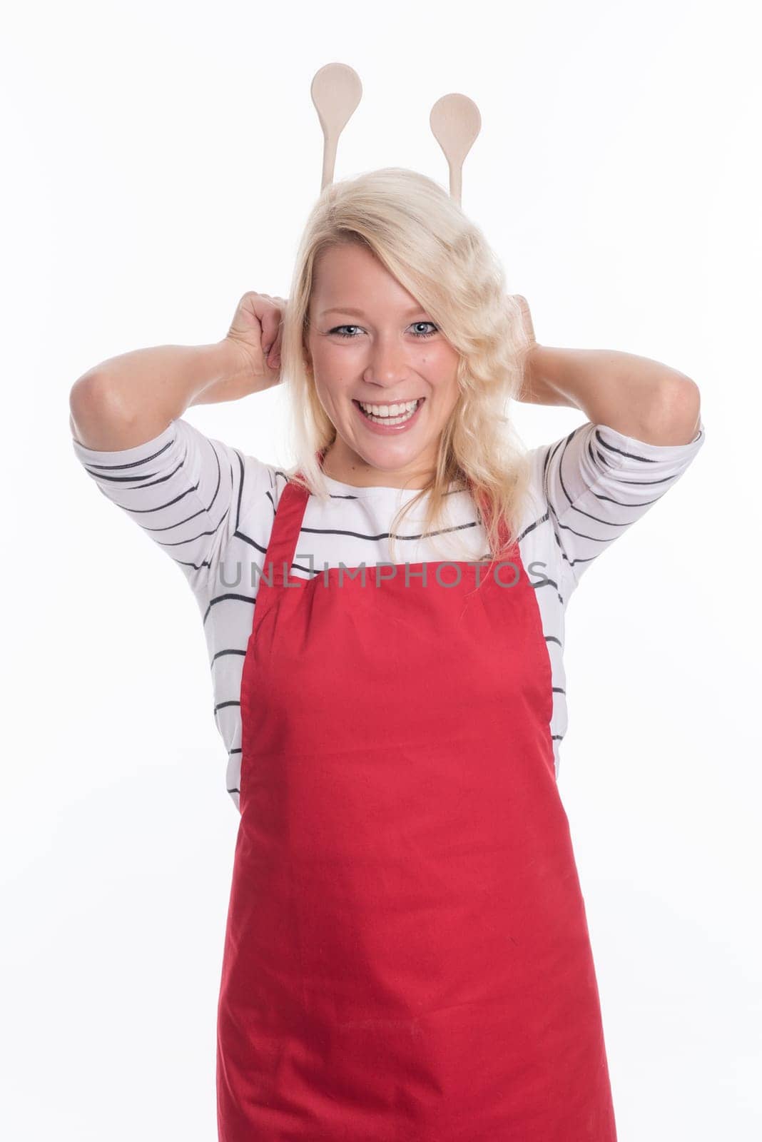 Housewife keeps cooking spoon behind her head
