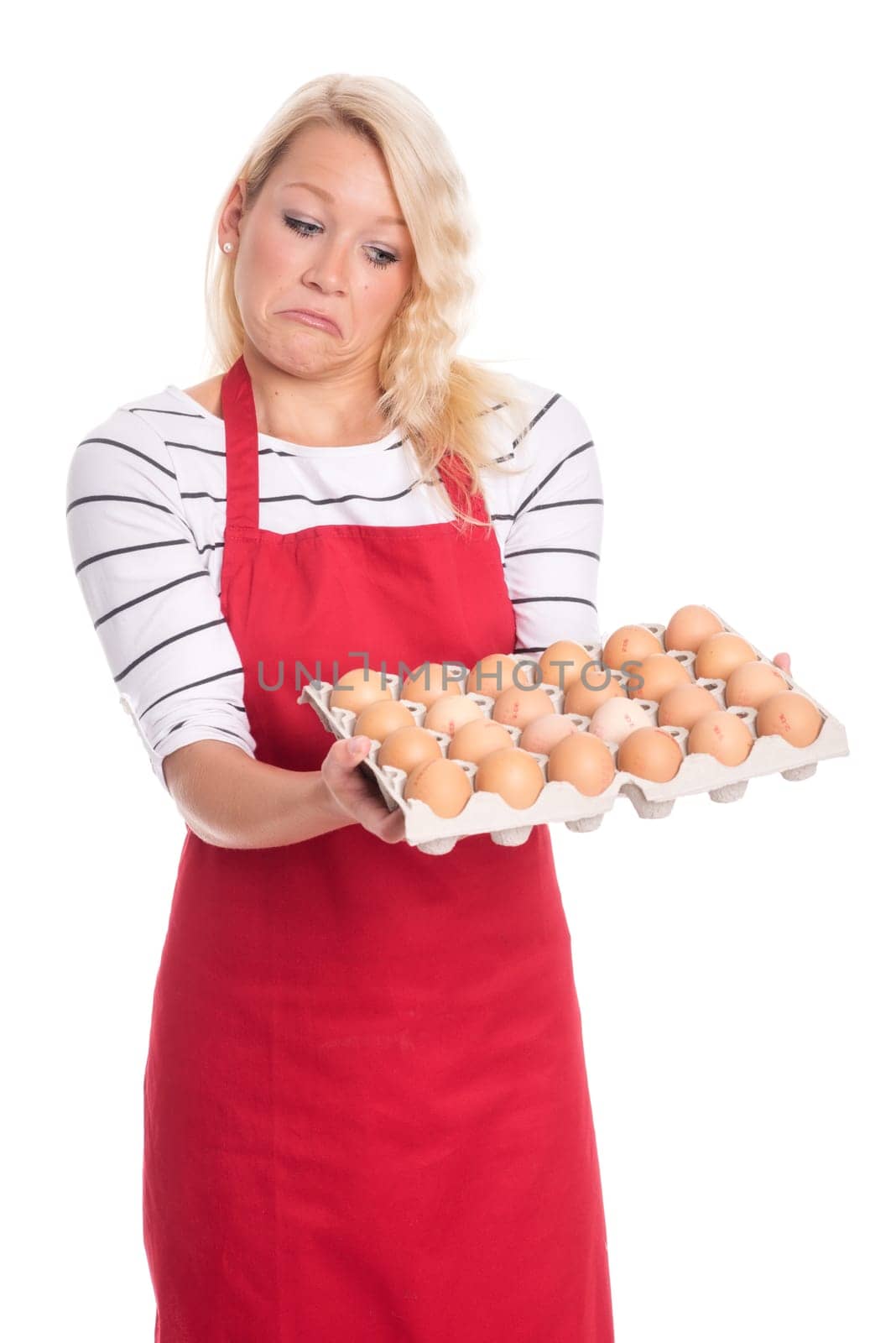 Woman with apron holds an egg pallet and pulls a snout