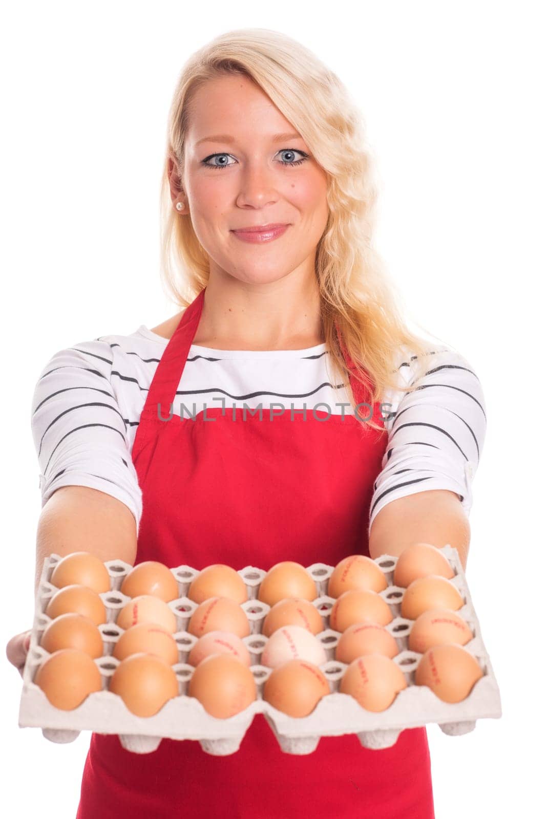 Woman with apron carries a palette of eggs