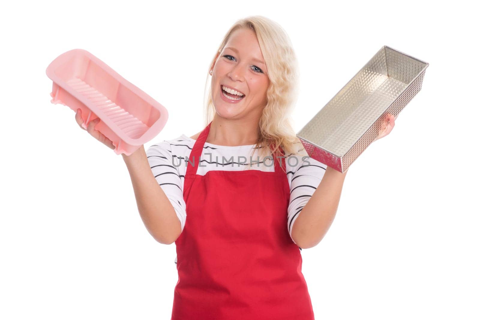 Housewife in kitchen apron keeps various baking tins