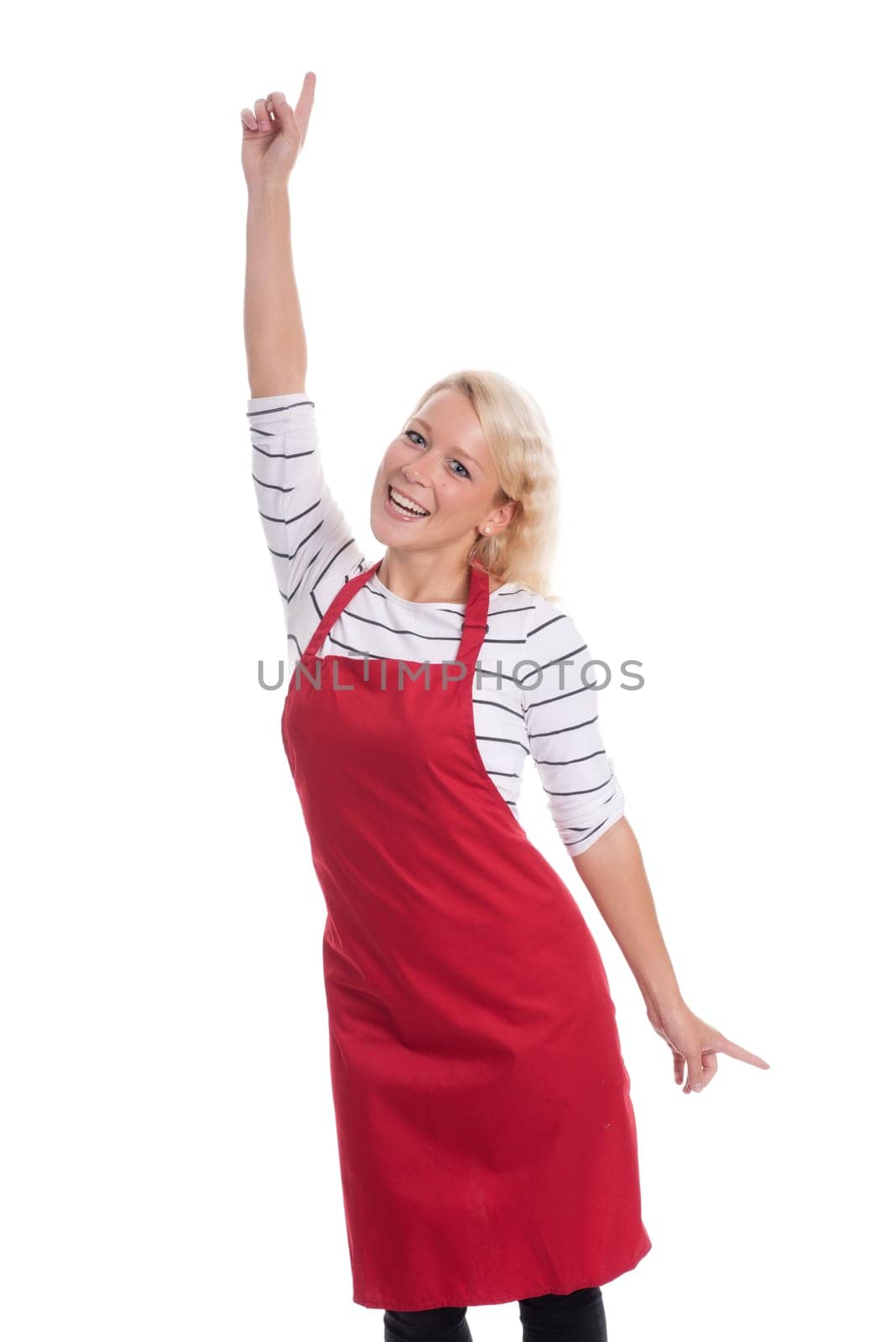 Housewife in red kitchen apron is cheerful and shows thumbs up