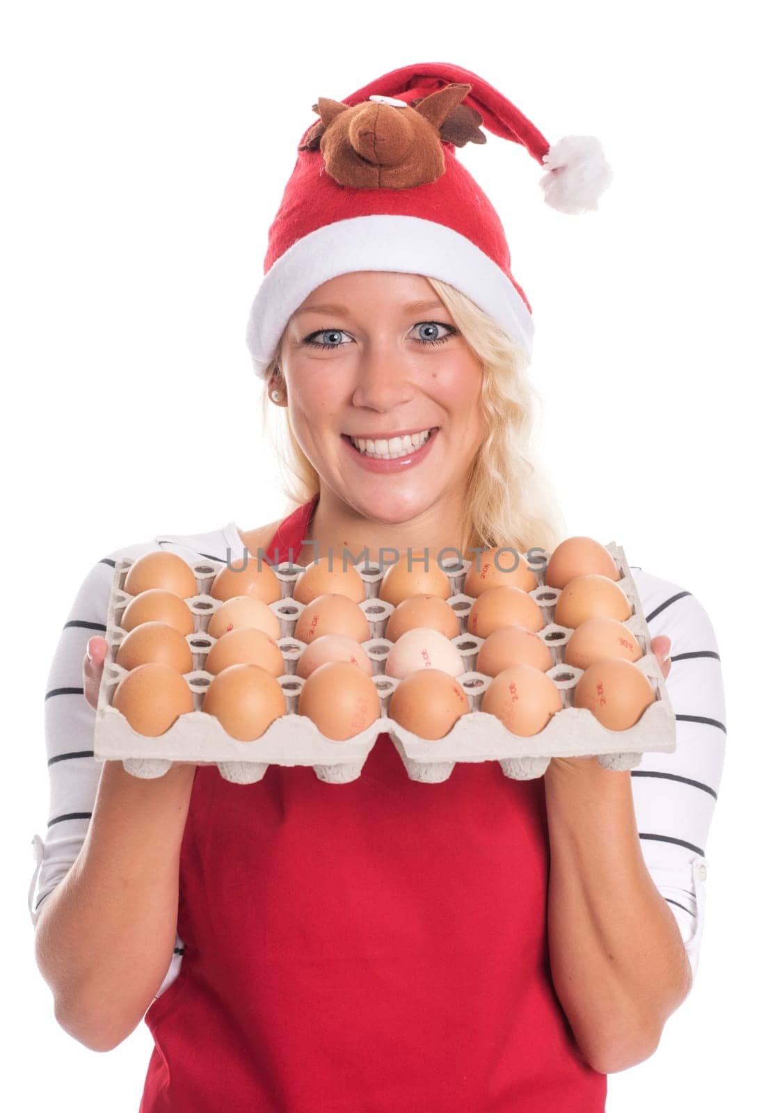Woman with Christmas hat and apron holds a palette of eggs