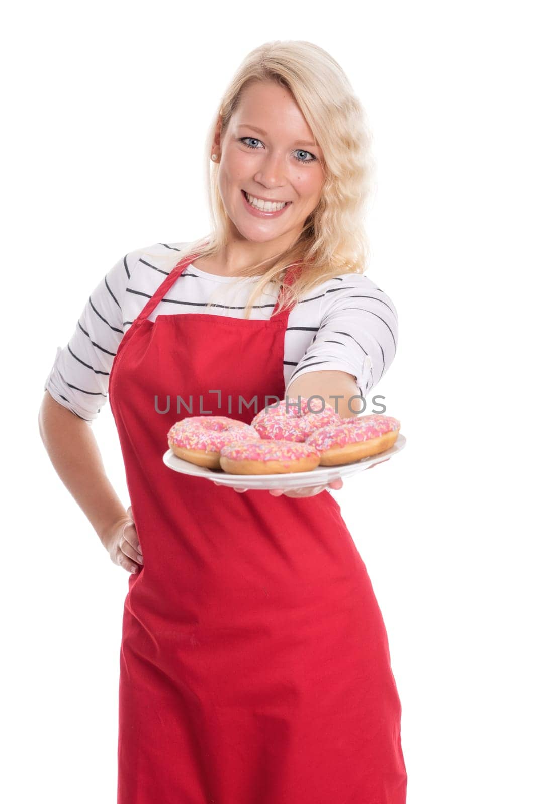 Housewife with apron offers doughnuts