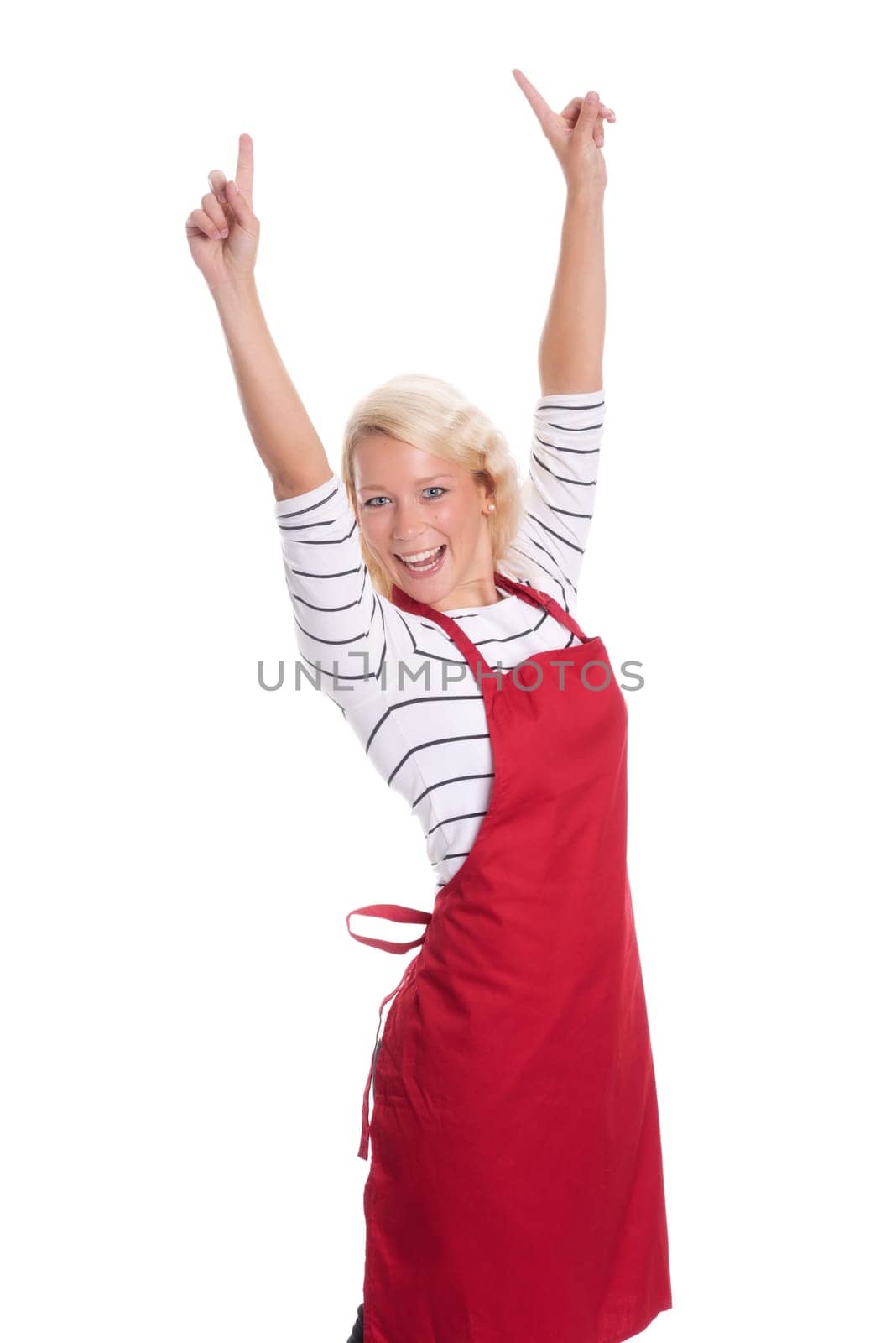 Housewife in red kitchen apron is cheerful and shows thumbs up