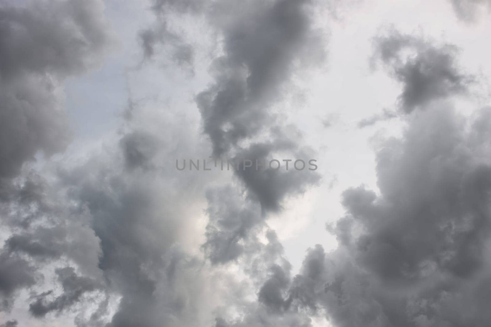 Grey tragic cloudscape with various density chaotic thunderclouds