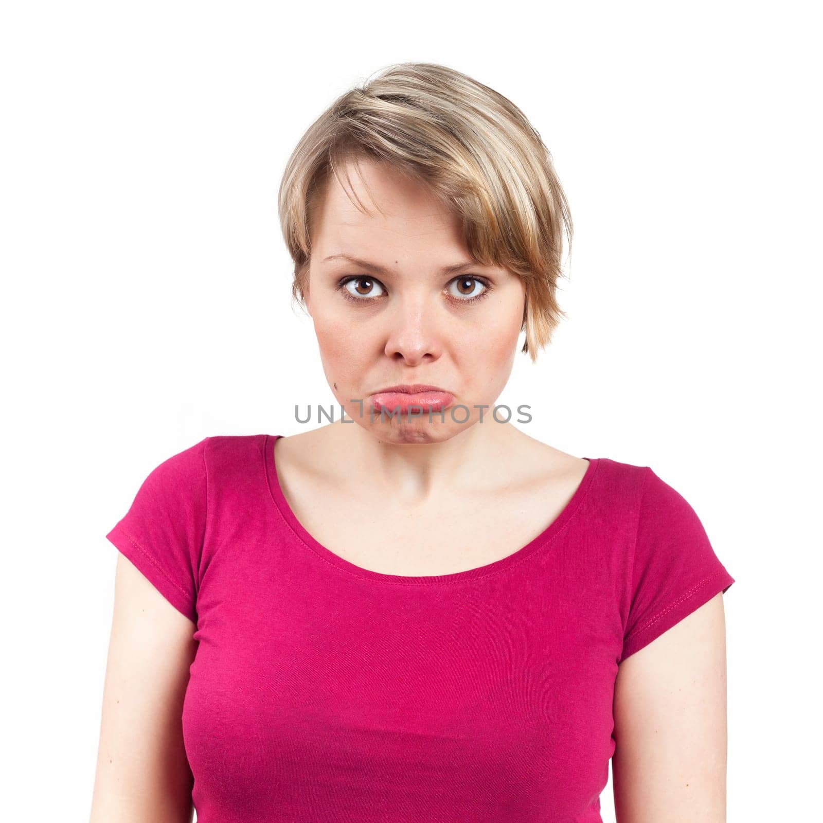 Young woman looking unhappy, doubtful, isolated on white