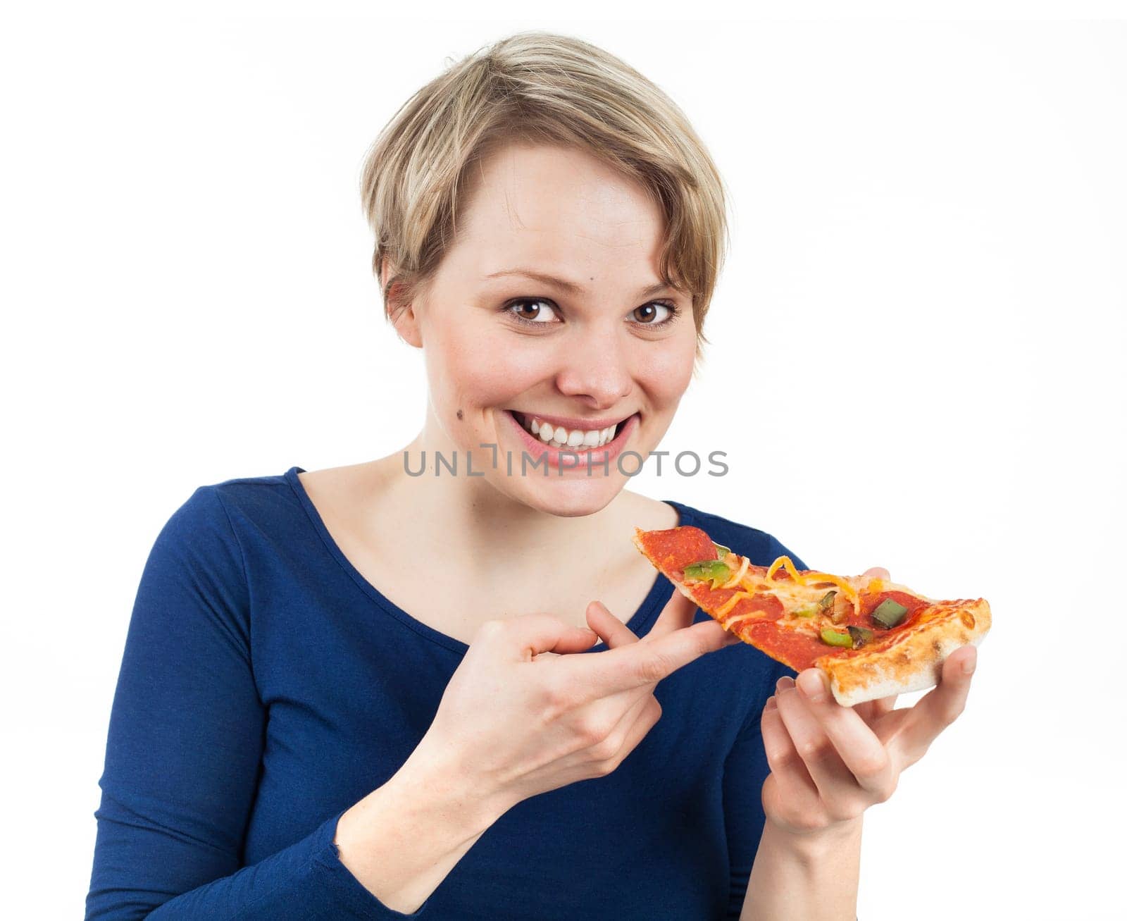 Young woman holding a slice of pizza and smiling, isolated on white