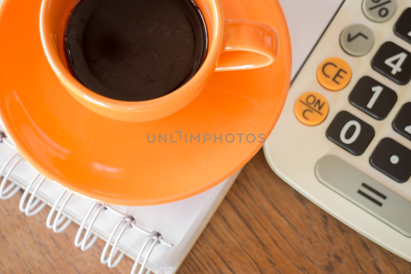 Hot coffee cup on wooden table, stock photo