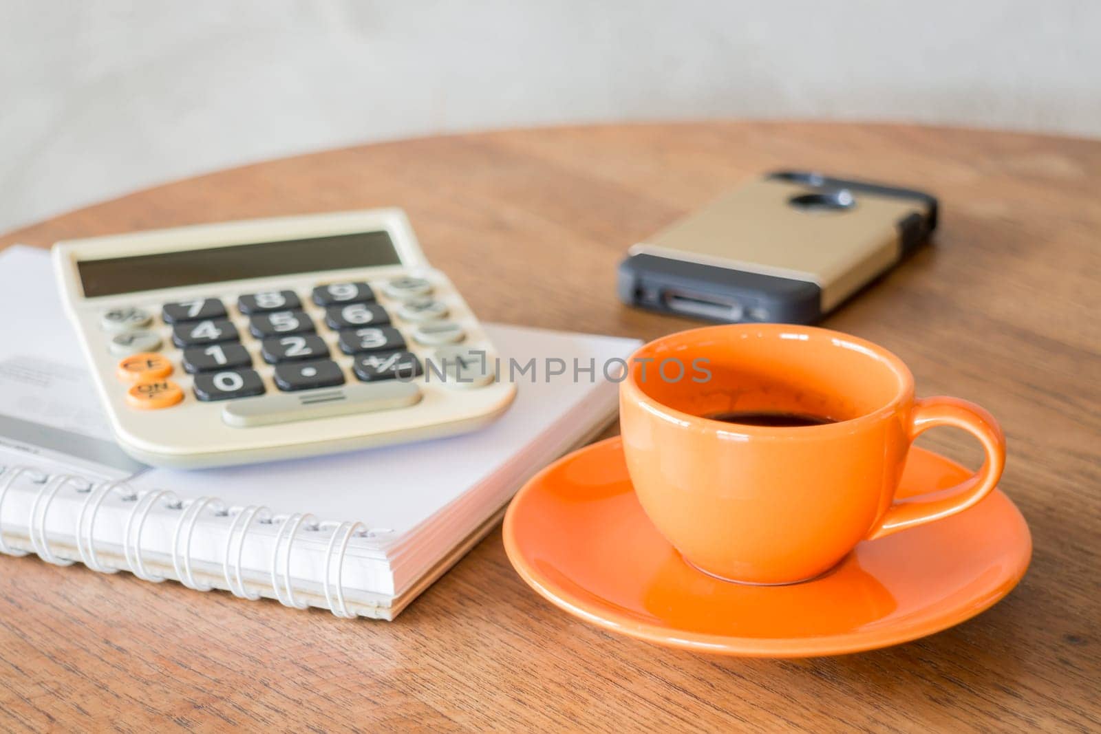 Hot coffee cup on wooden table, stock photo