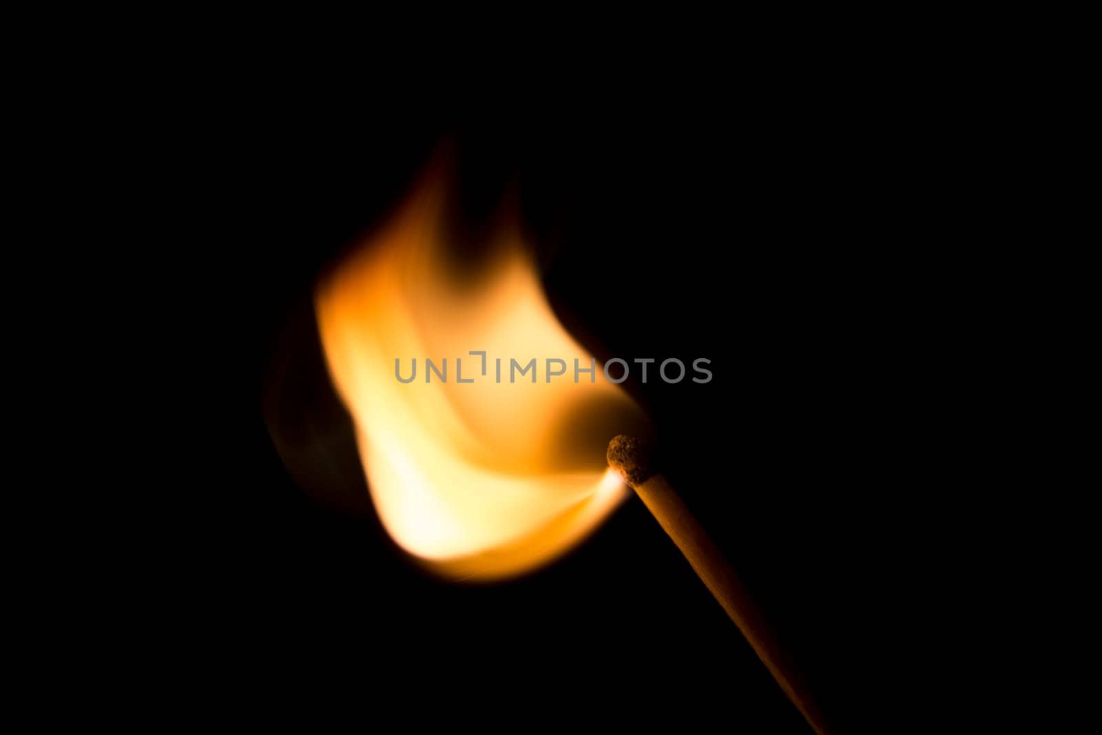 Match Igniting in a burst of fire. Macro Image.