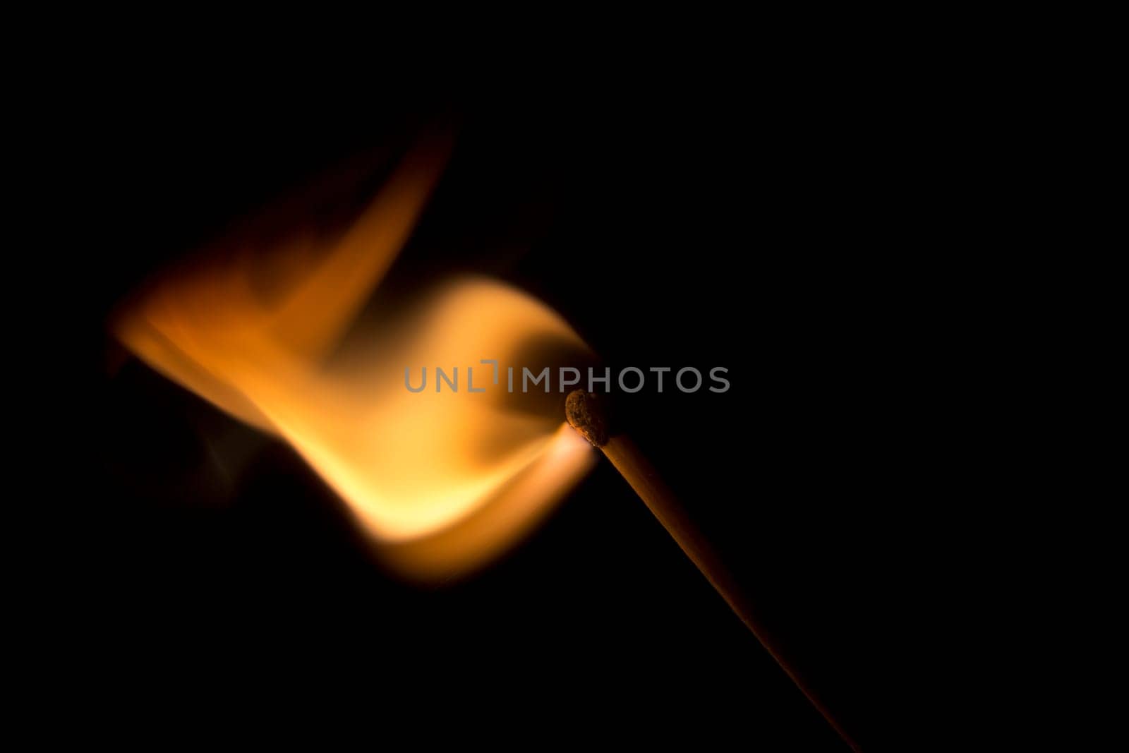 Match Igniting in a burst of fire. Macro Image.