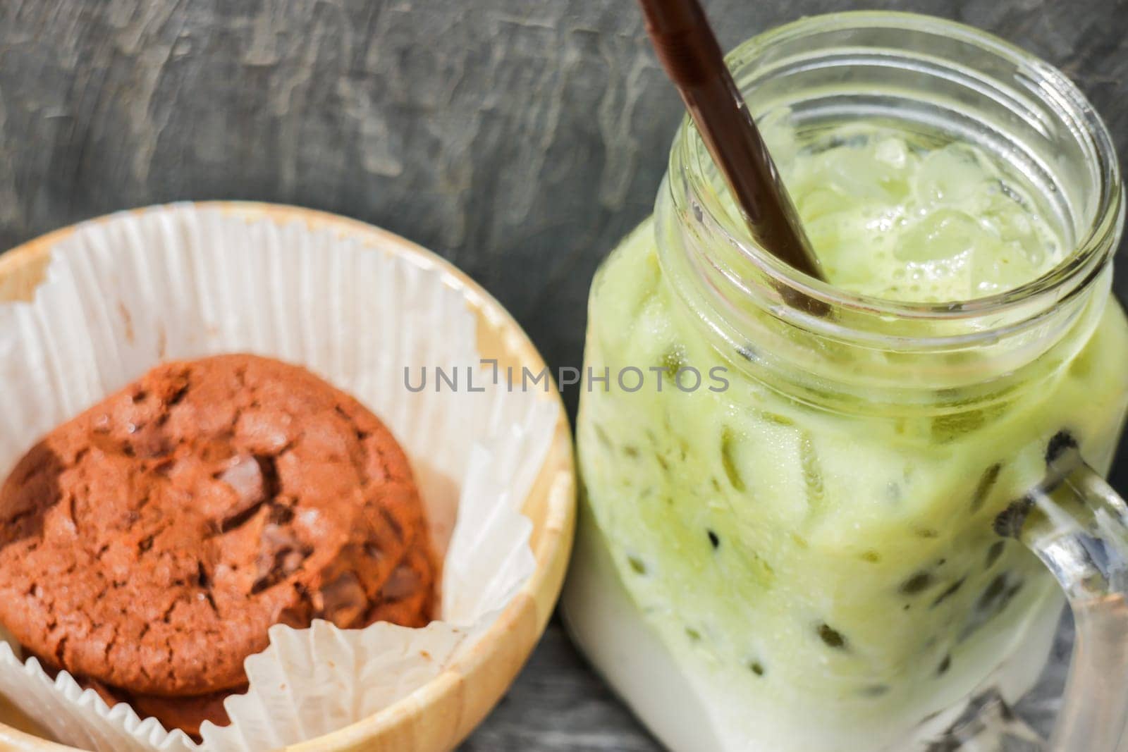 Iced green tea latte and chocolate cookies, stock photo