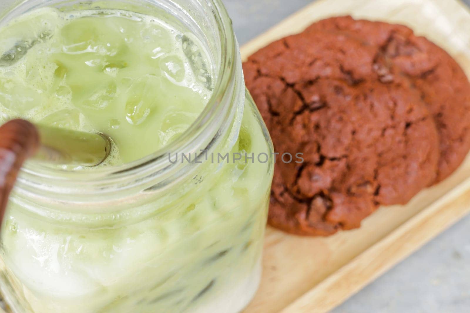 Iced green tea latte and chocolate cookies, stock photo