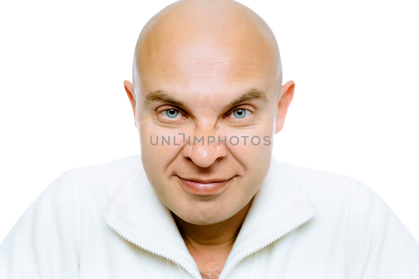 Bald evil grinning man. Isolated on white. Studio