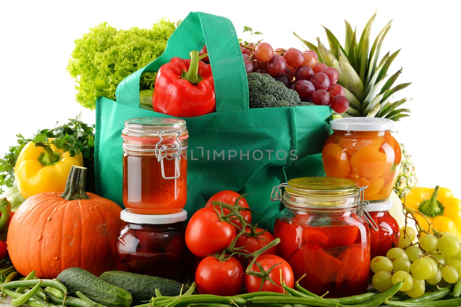 Composition with shopping bag and organic food over white. Balanced diet