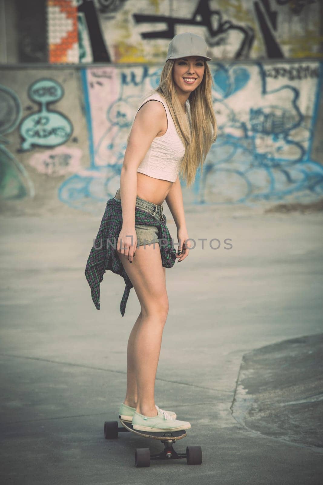 Young woman riding a skateboard