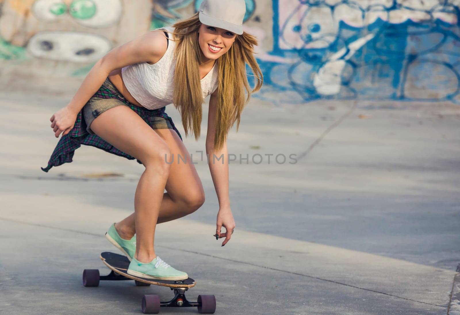 Young woman riding a skateboard