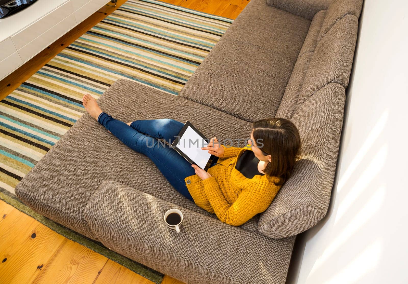 Shot of a gorgeous young woman using a digital tablet indoors, with copy space