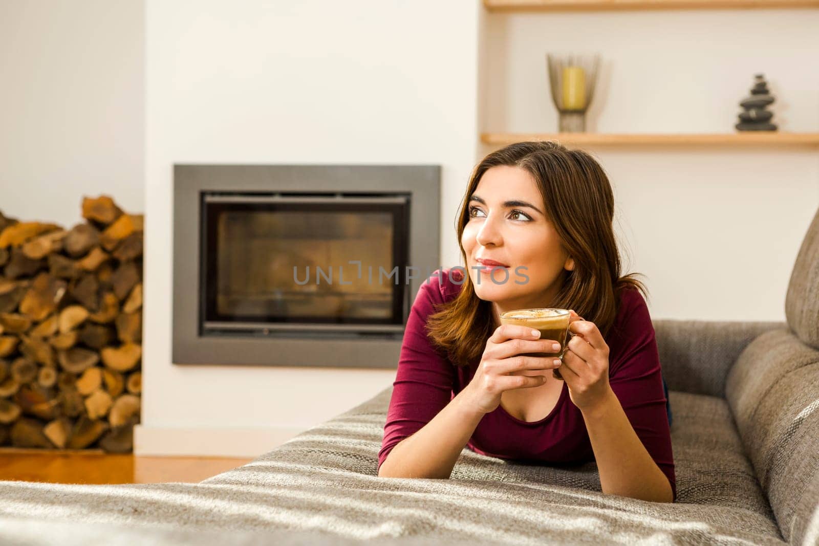 Beautiful woman at home Having a good time with cup a coffee