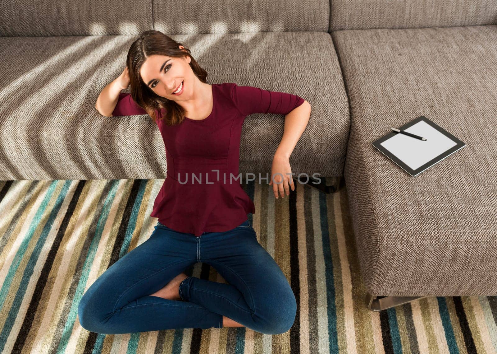 Gorgeous woman at home working with a tablet