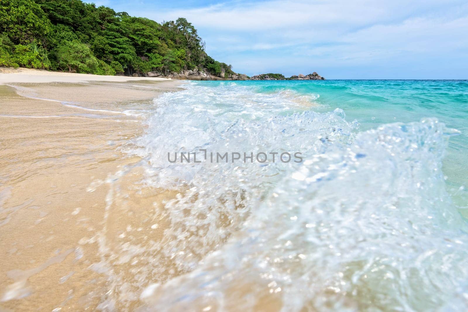Beautiful landscape blue sea white sand and waves on the beach during summer at Koh Miang island in Mu Ko Similan National Park, Phang Nga province, Thailand
