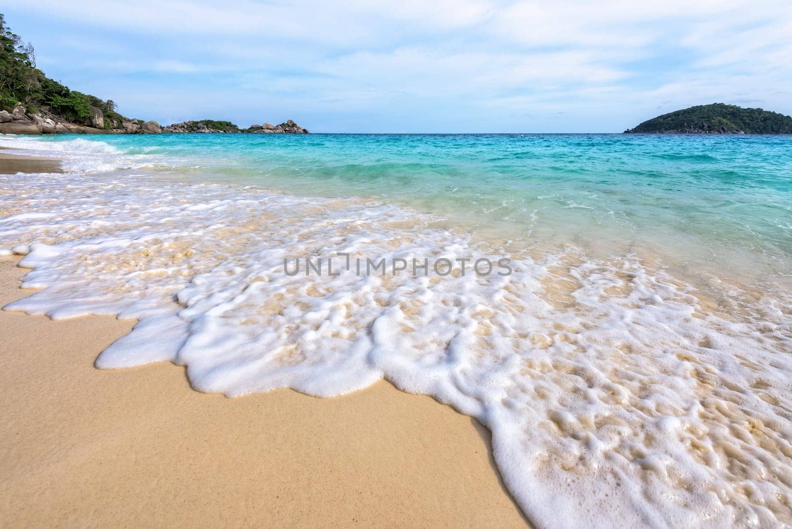Beautiful landscape blue sea white sand and waves on the beach during summer at Koh Miang island in Mu Ko Similan National Park, Phang Nga province, Thailand
