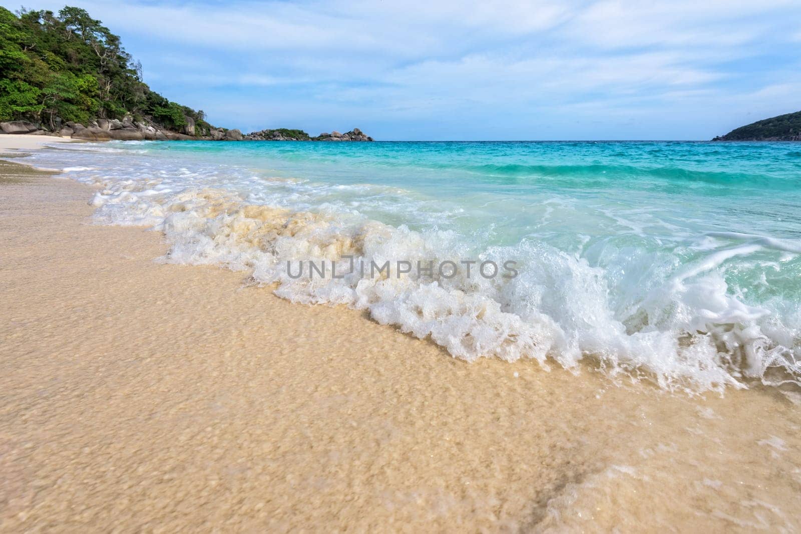 Beautiful landscape blue sea white sand and waves on the beach during summer at Koh Miang island in Mu Ko Similan National Park, Phang Nga province, Thailand