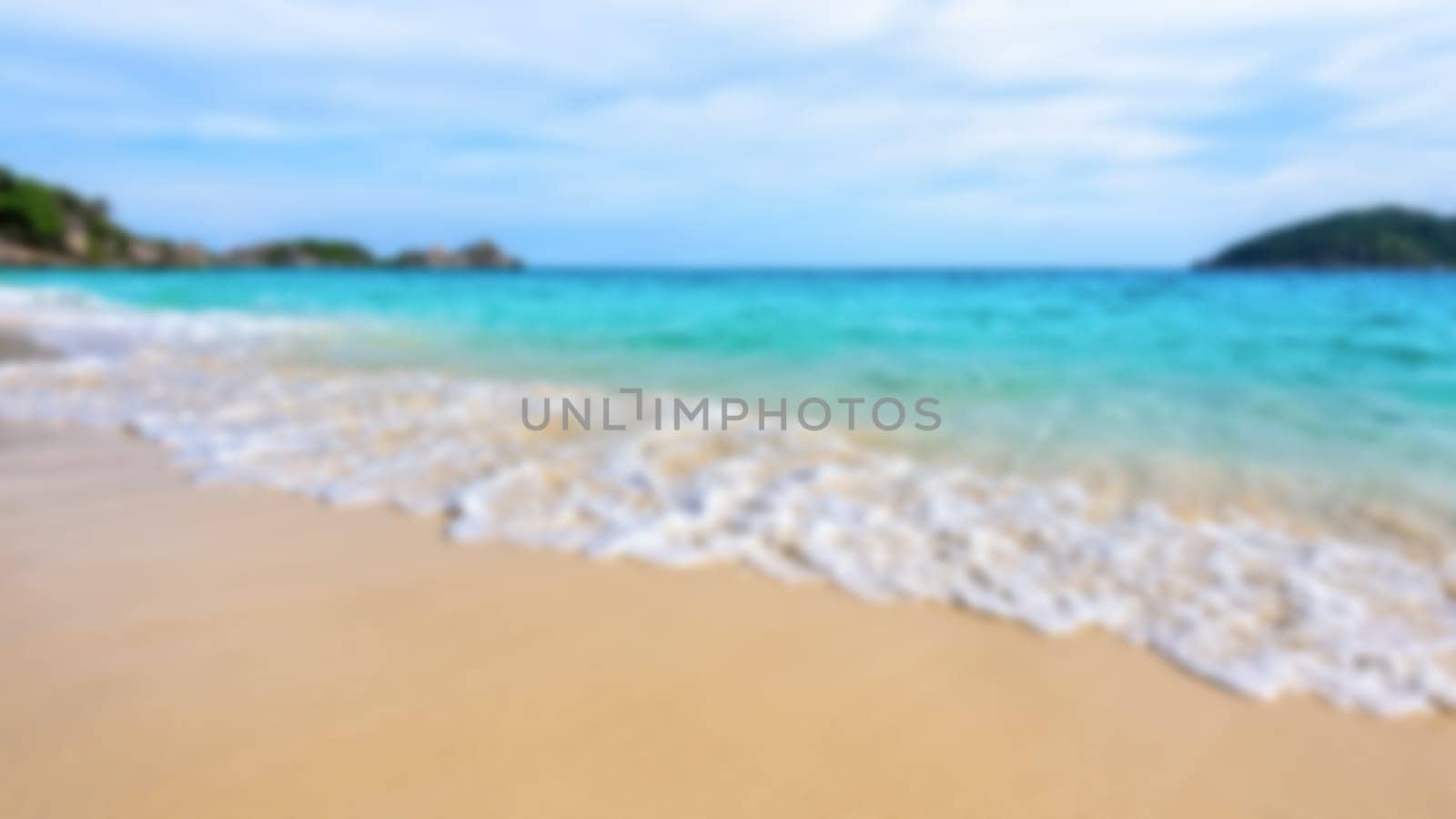 Blurred photograph for background beautiful landscape blue sea and white waves on beach in summer at Koh Miang island, Mu Ko Similan National Park, Phang Nga province, Thailand, 16