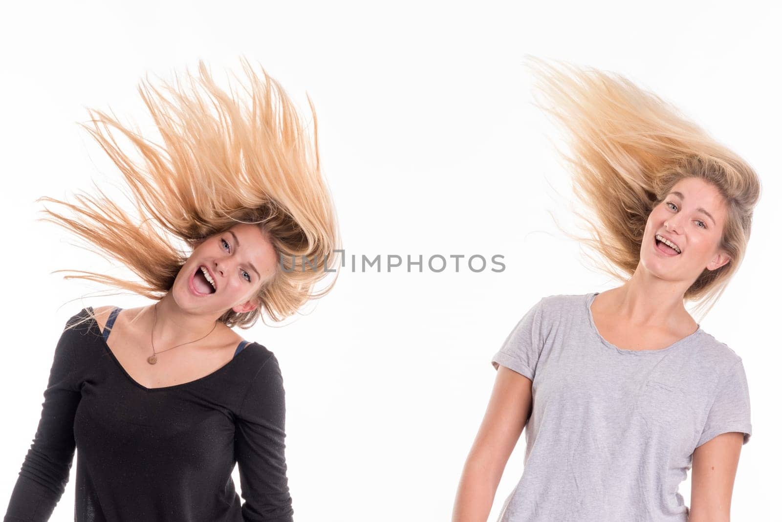 2 blonde girls shake their hair