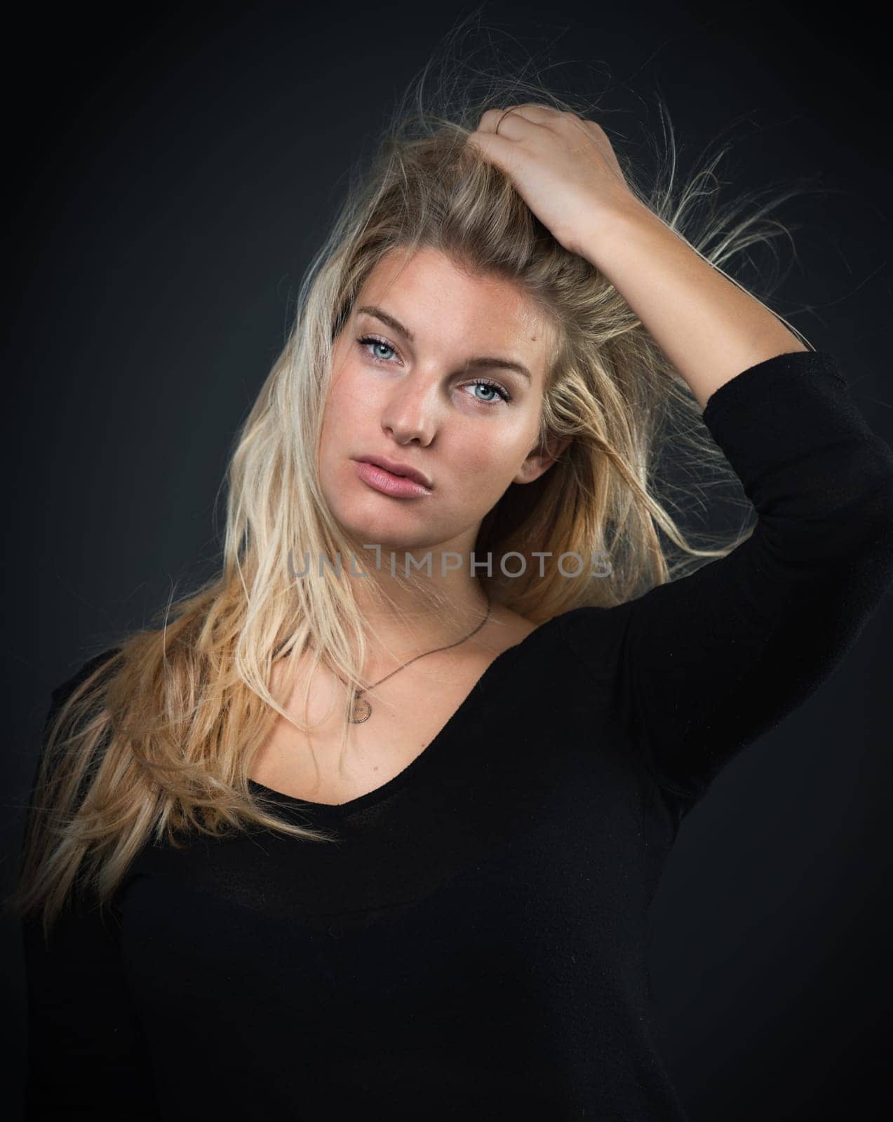 Young blonde woman with erotic charisma