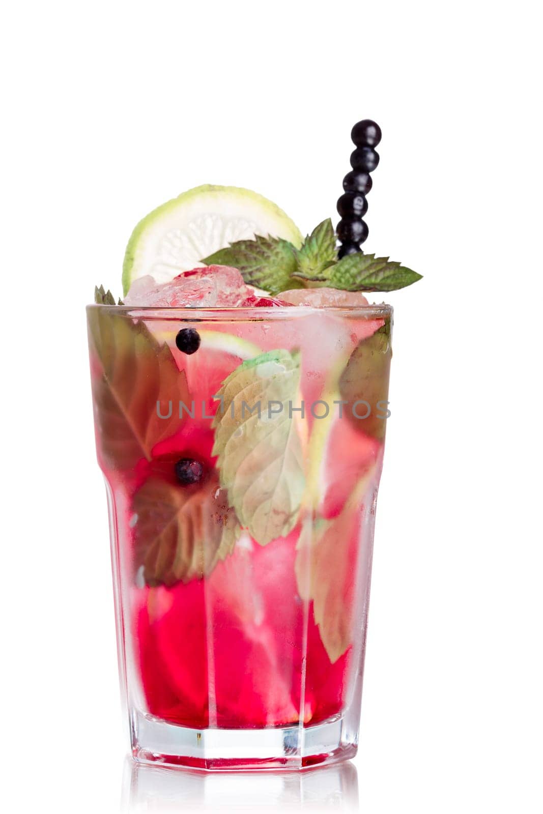 Blueberry mojito garnished with lime slice,skewered blueberries and fresh mint