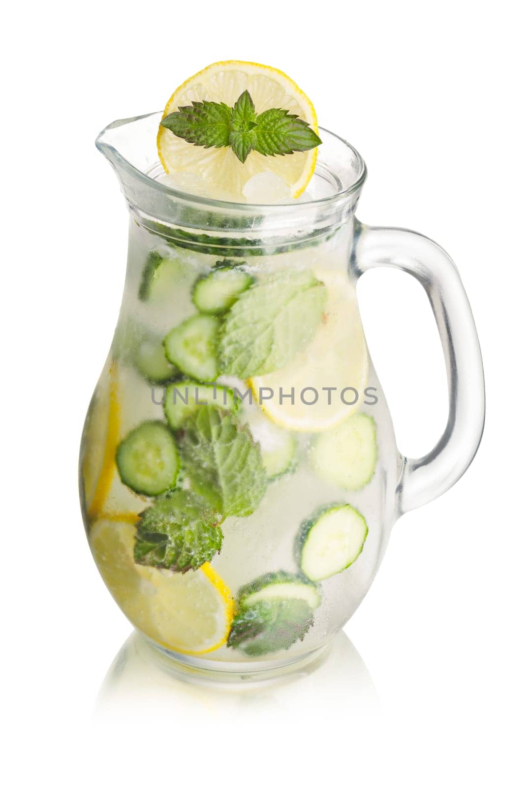 Sparkling cucumber lemonade in a glass pitcher. Refreshing summer soda with lemon, mint and cucumber