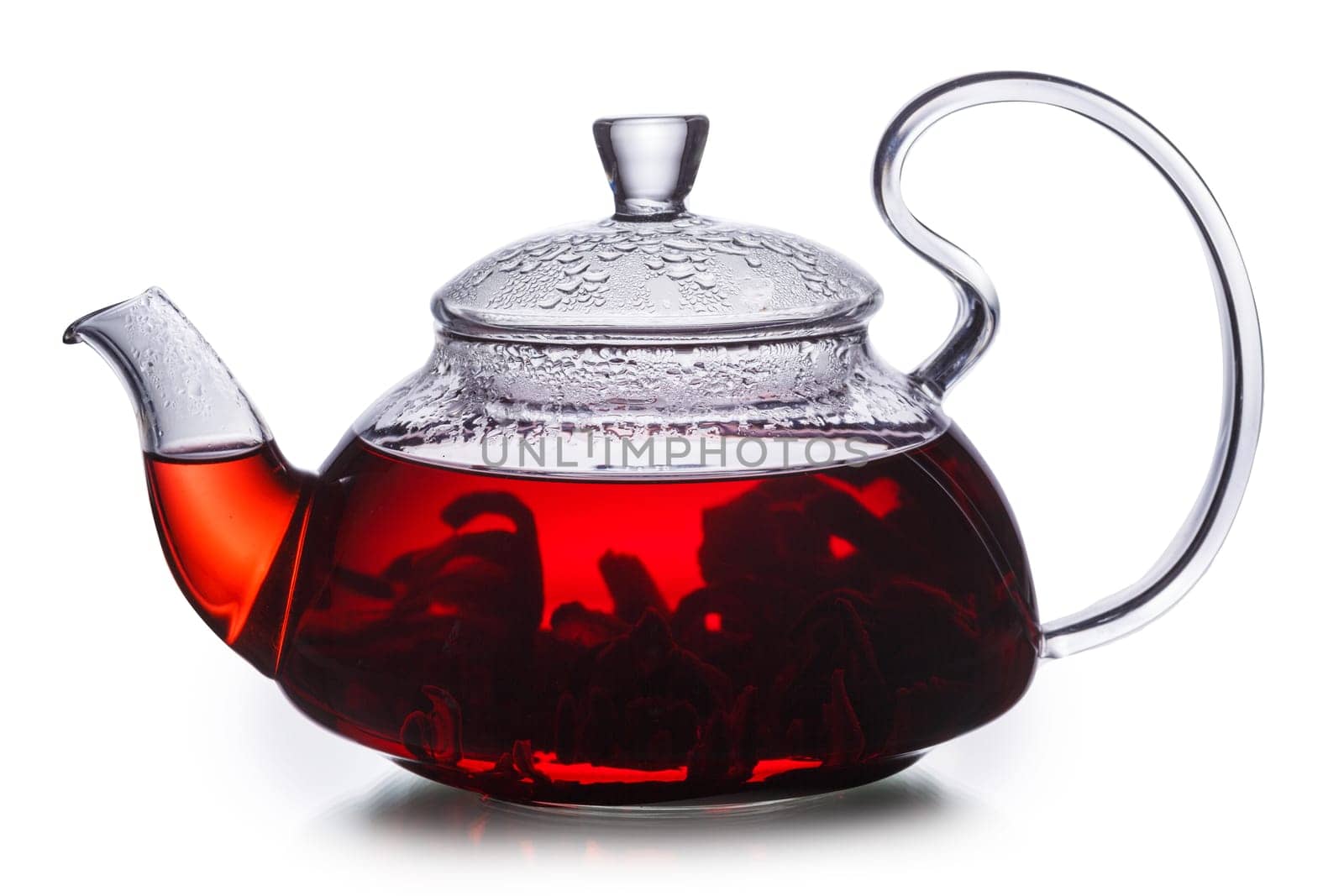 Hibiscus tea in transparent teapot. Worldwide popular healthy tea known as rosella, karkade or red sorrel.