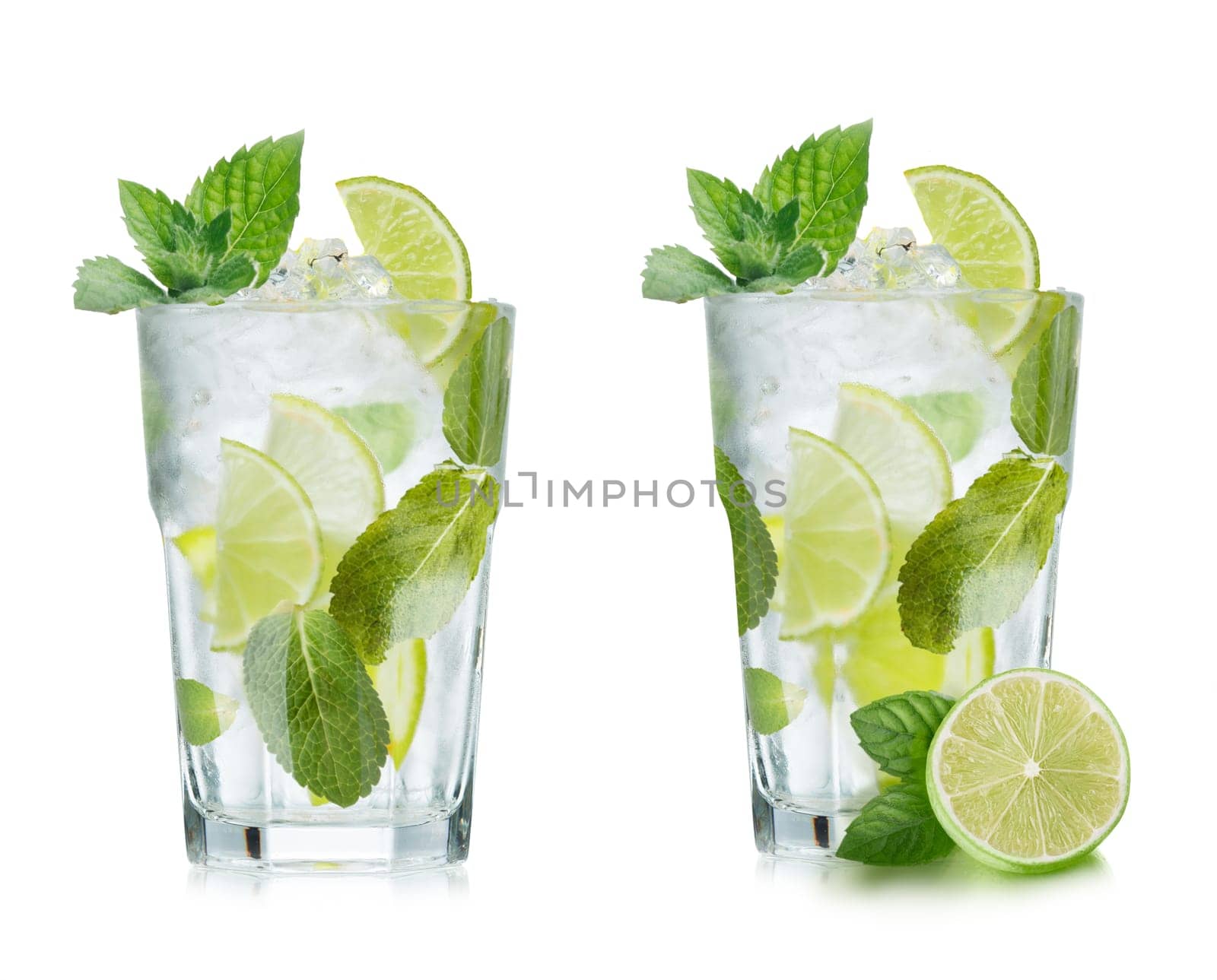 Mojito cocktail in elegant highball glass. Cold refreshing beverage with lime and mint.
