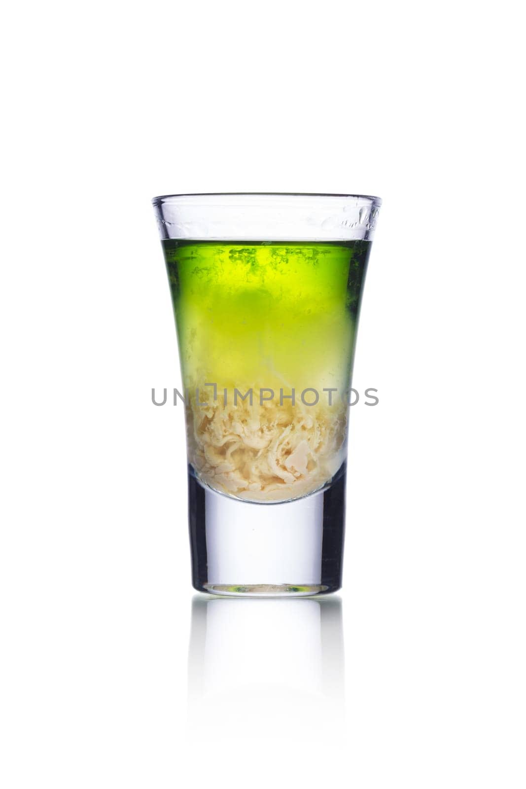 Colorful alcoholic cocktail in a shot glass