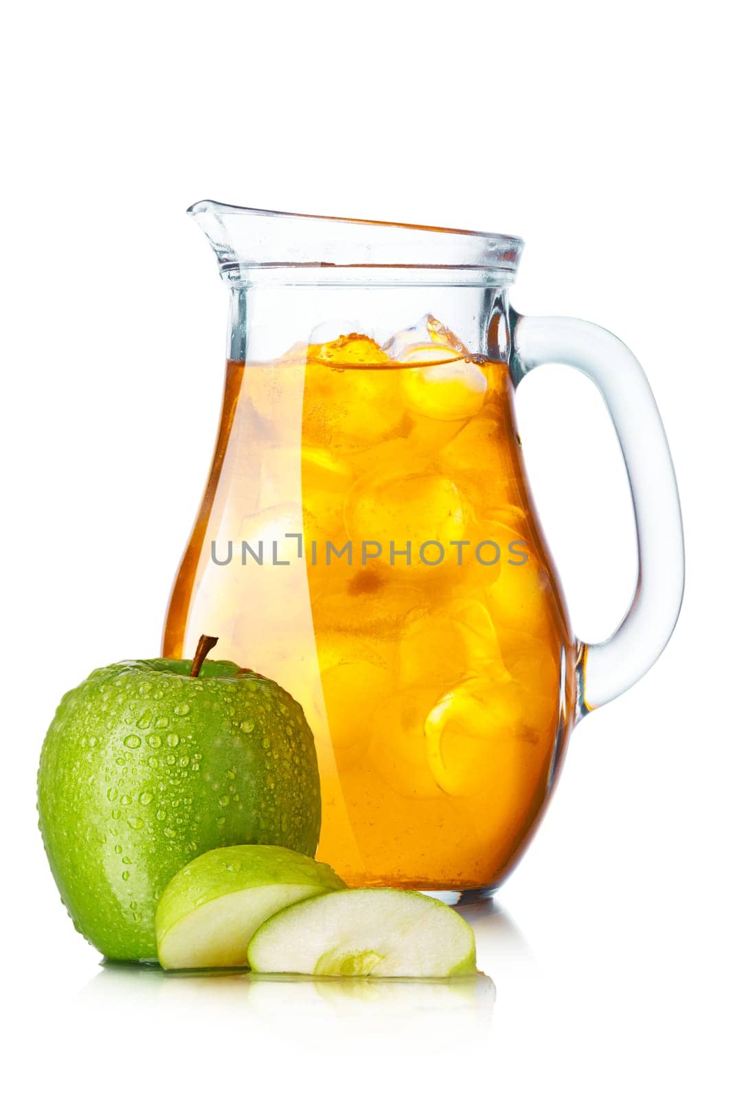 Apple juice with ice in a pitcher. Jug full of iced apple mixed drink.