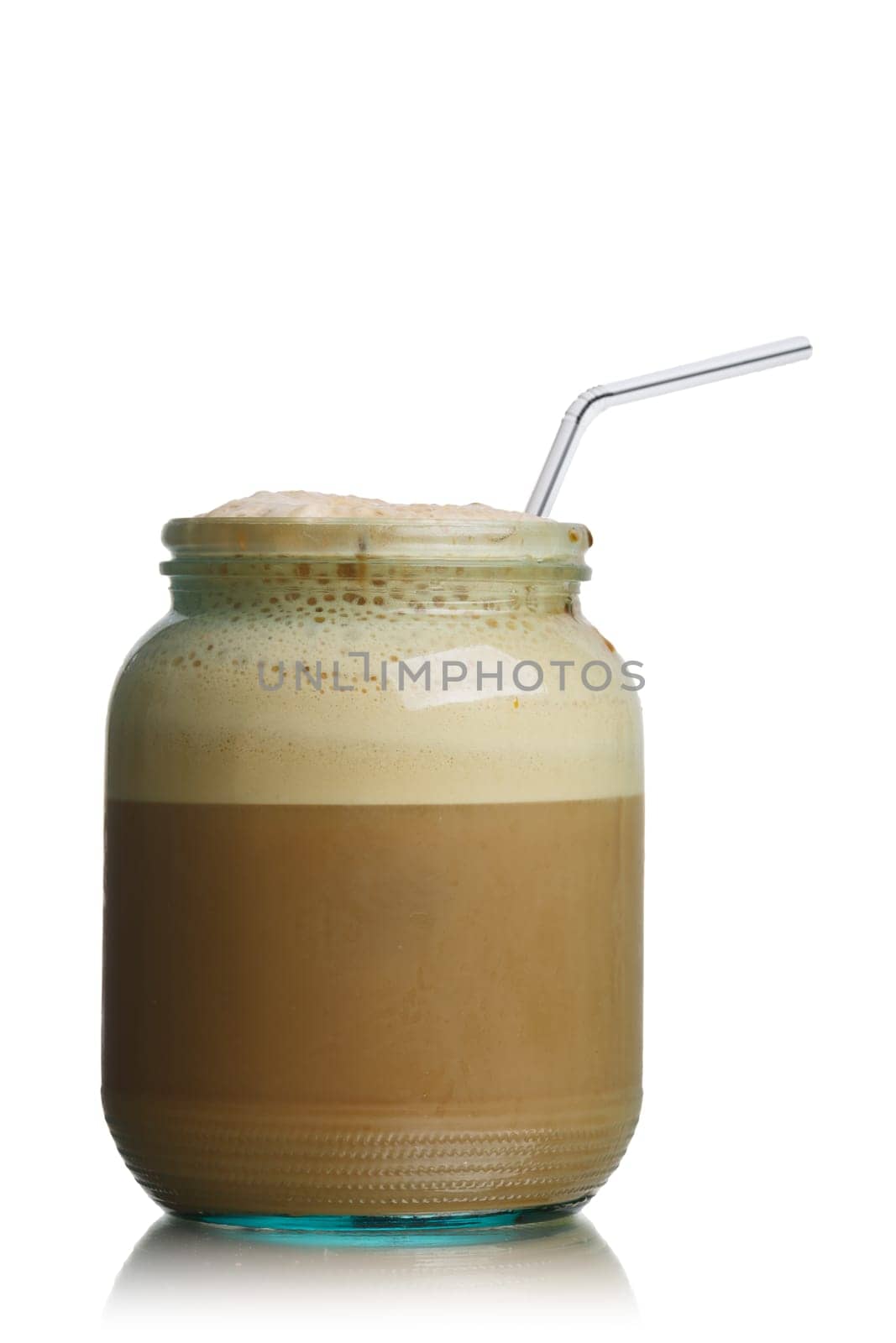 Glass jar of homemade New York Egg Cream fizzy drink contains neither eggs nor cream. The basic ingredients are milk, seltzer, and chocolate syrup