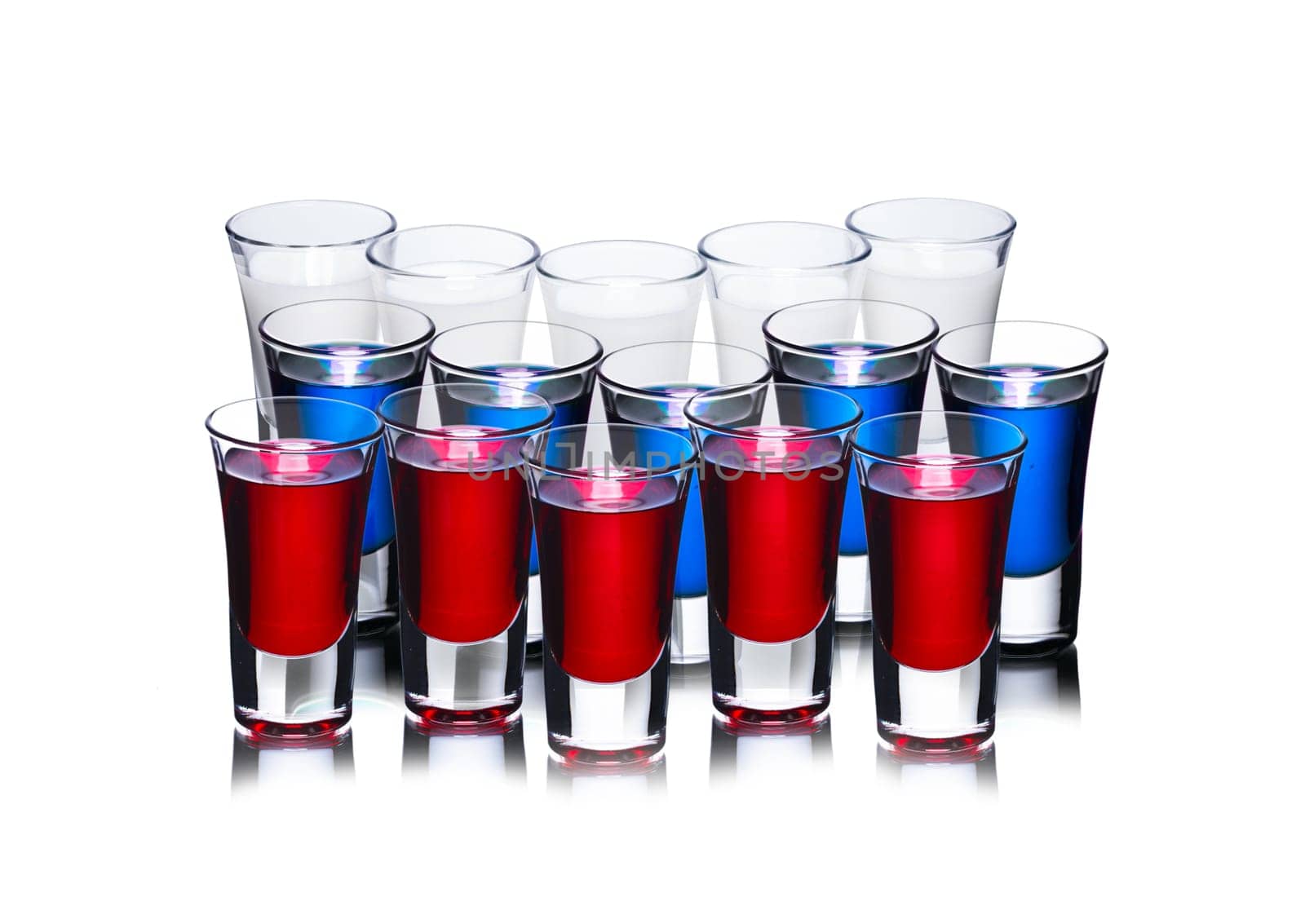 Alcoholic cocktails in shot glasses in shape of Russian flag. Conceptual image