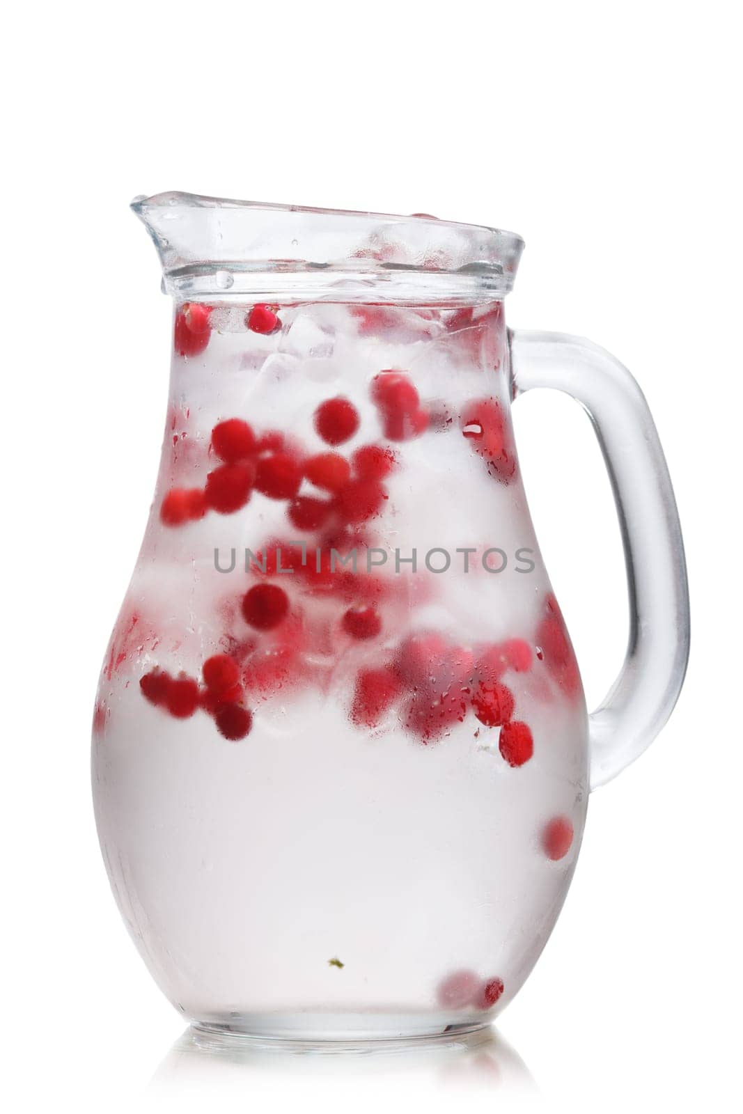 Cranberry  detox water in a glass jug. Healthy iced water infused with cranberry, cowberry and lemon