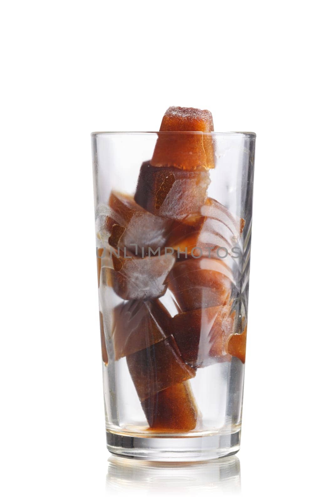 Frozen coffee cubes into highball glass. Preparations for iced coffee cocktail
