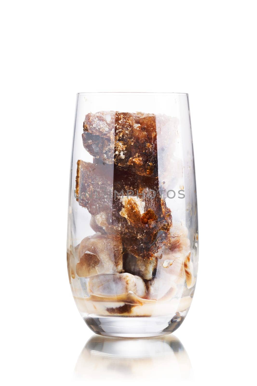 Milk coffee cocktail from frozen coffee cubes in highball glass. Iced milk coffee