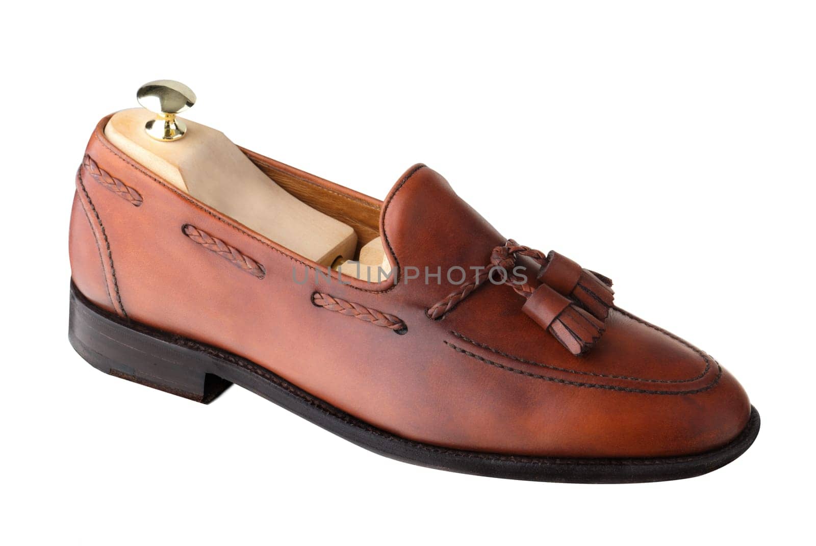 Almost unworn, single tasseled, handcrafted men's loafer with shoe tree inserted.  The upper is dark leaf calf.