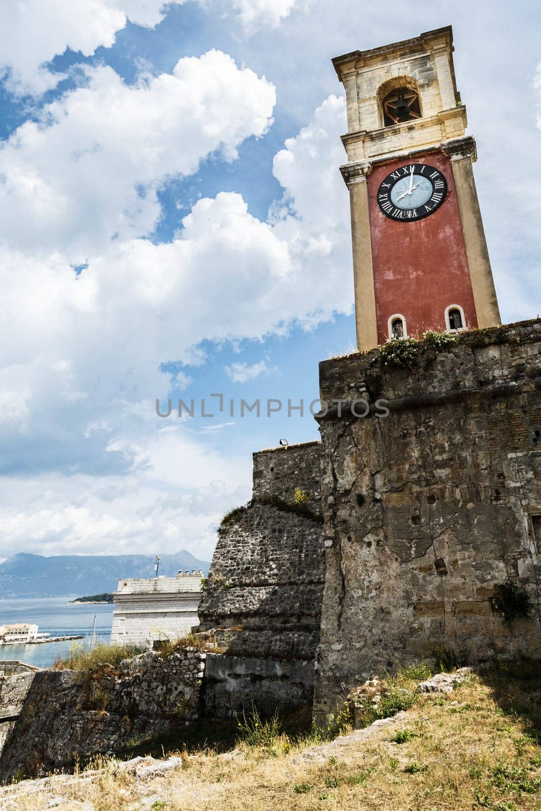 Old tower with clock on the fortress on the Greek island of Corfu (Kerkyra)