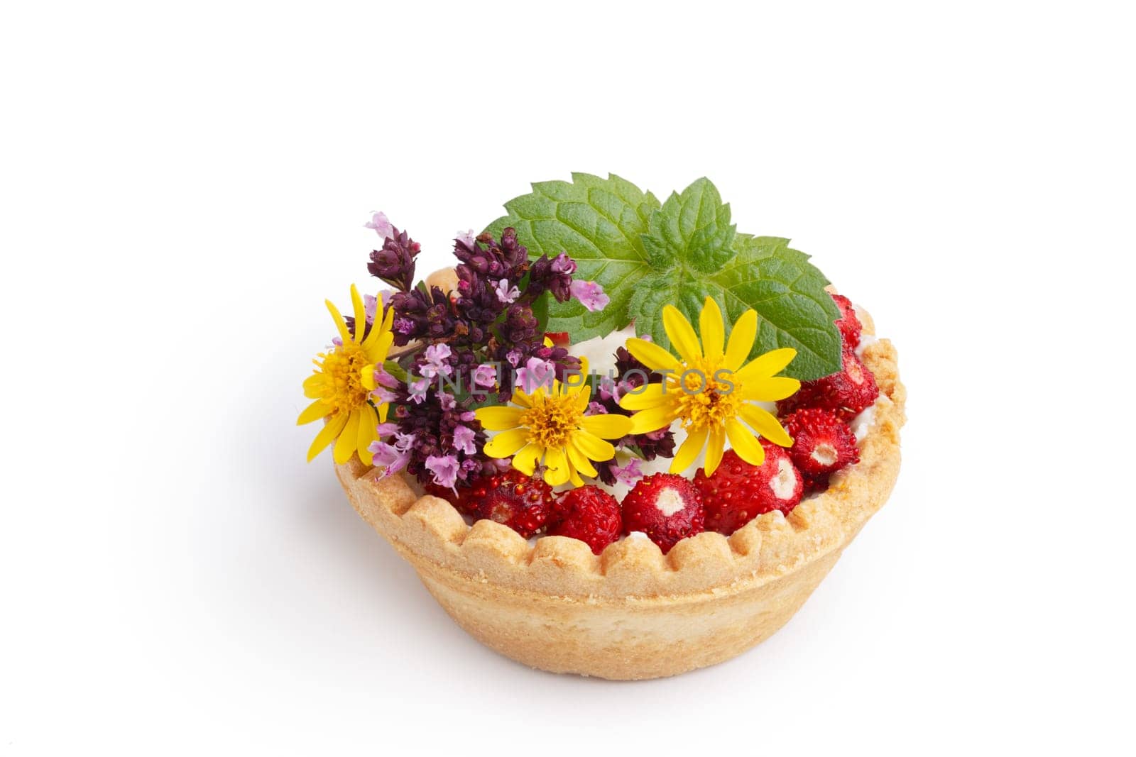 Dessert with wild berries decorated with mint leaves and wildflowers. Sweet tart with wild strawberry, blueberry and red currant. Large DOF