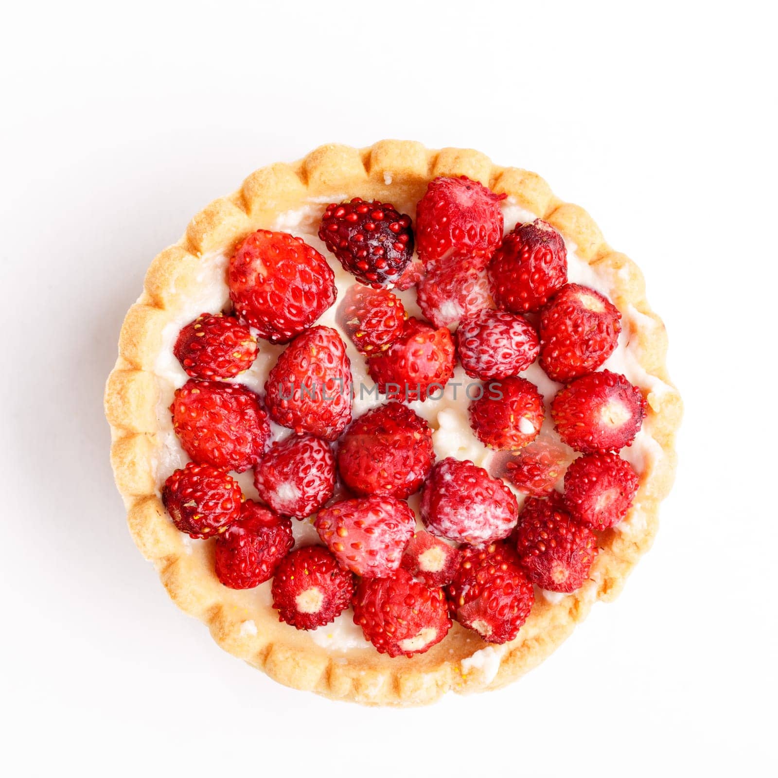 Dessert with wild strawberries.  Sweet tart with wild strawberry