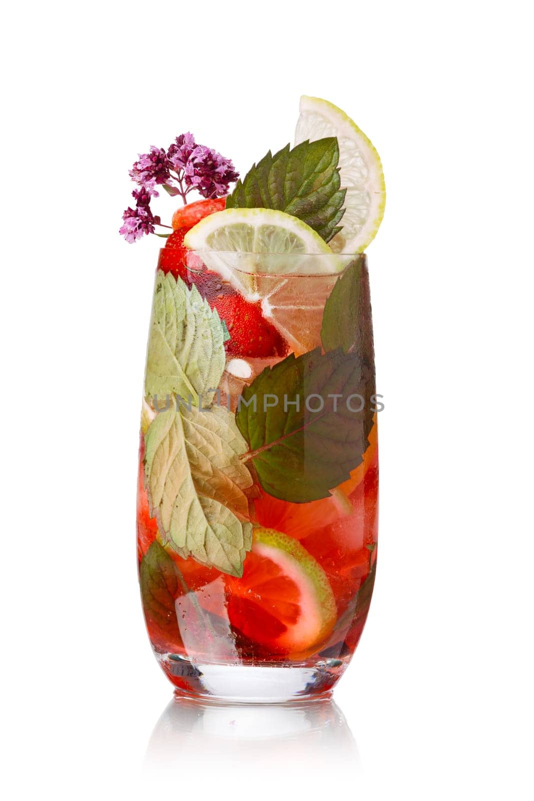 Strawberry mojito garnished with lime slice and marjoram (wild oregano)