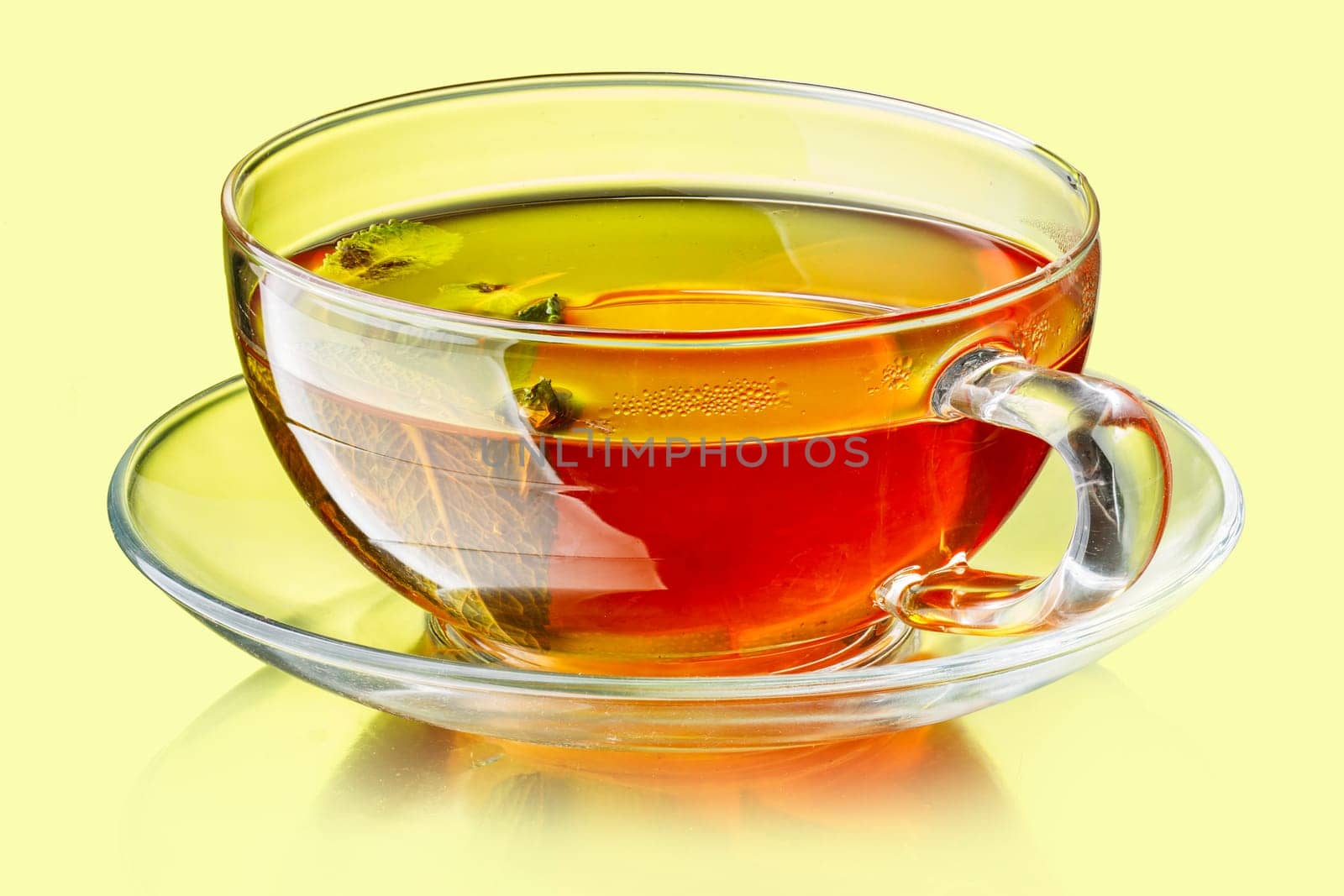 Cup of tea with lemon and mint leaves