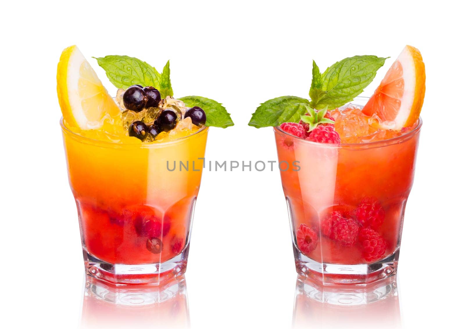 Two summer alcoholic cocktails isolated on white