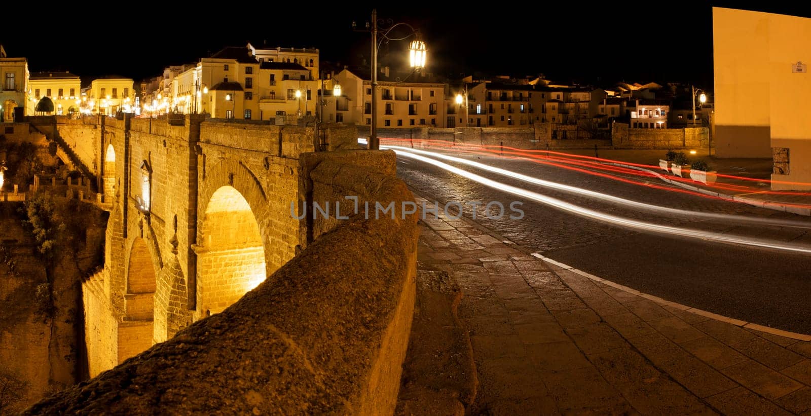 Illuminated bridge from old town of Ronda, Spain. Night scene