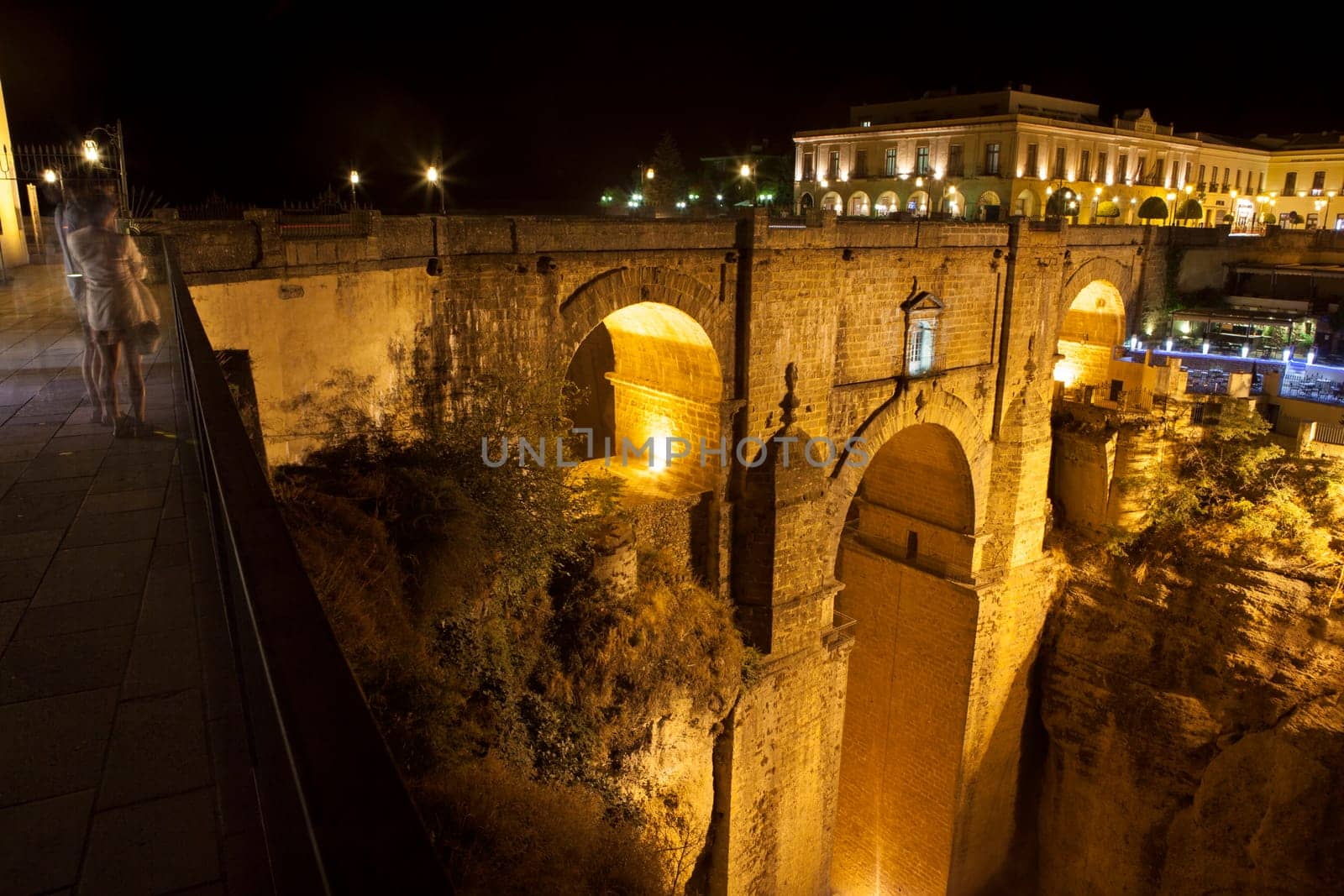 Illuminated bridge from old town of Ronda, Spain. Night scene